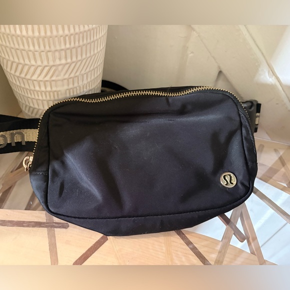 Handbags - Lululemon Everywhere Belt Bag 1L in black with gold hardware.